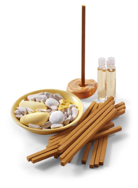 Latino aroma set with holder, joss sticks, two bottles of oil and a dish with stones.